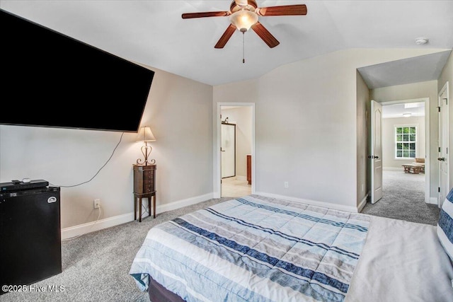  - carpeted bedroom with lofted ceiling, a ceiling fan, and baseboards