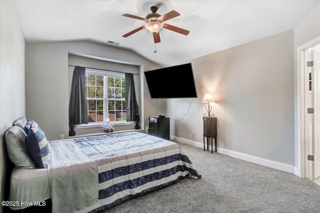  - carpeted bedroom featuring baseboards, vaulted ceiling, visible vents, and ceiling fan
