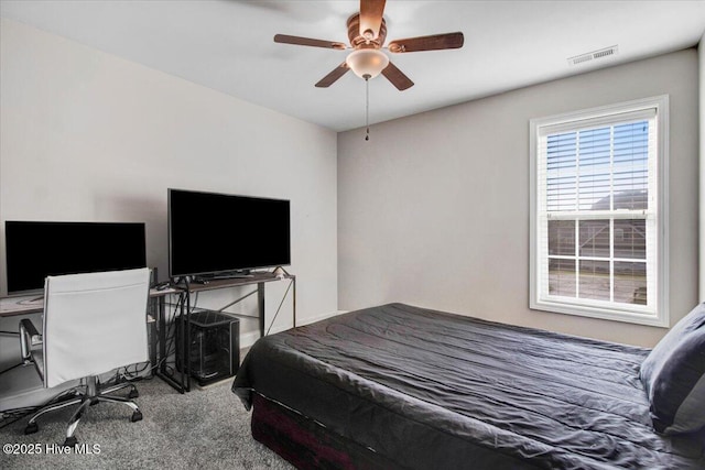  - bedroom featuring ceiling fan, baseboards, visible vents, and carpet