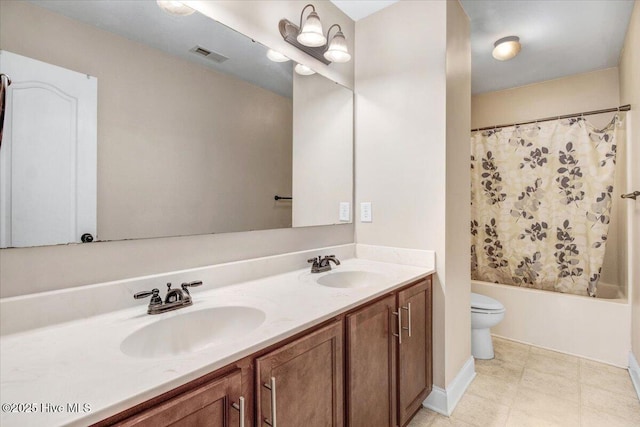  - bathroom with double vanity, visible vents, toilet, and a sink