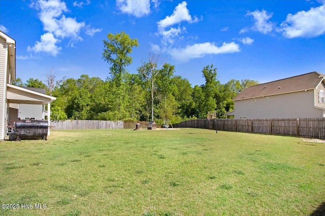  - view of yard with a fenced backyard