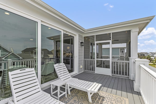 wooden terrace with a sunroom