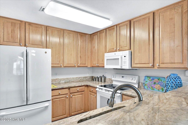 260 S Crow Creek Dr NW Lot 18, Calabash, NC 28467 - kitchen featuring a sink, white appliances, and light stone countertops