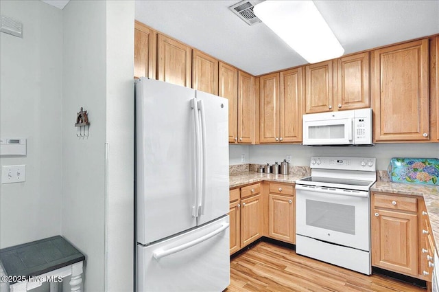 260 S Crow Creek Dr NW Lot 18, Calabash, NC 28467 - kitchen featuring white appliances, visible vents, and light wood-style flooring