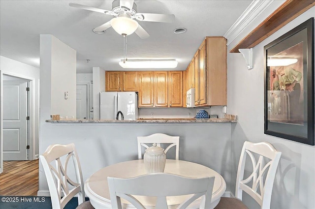 260 S Crow Creek Dr NW Lot 18, Calabash, NC 28467 - dining space with ceiling fan and wood finished floors