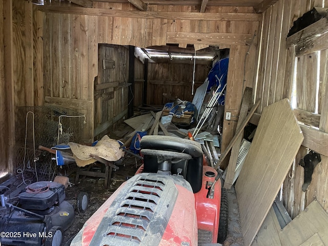 miscellaneous room with wood walls