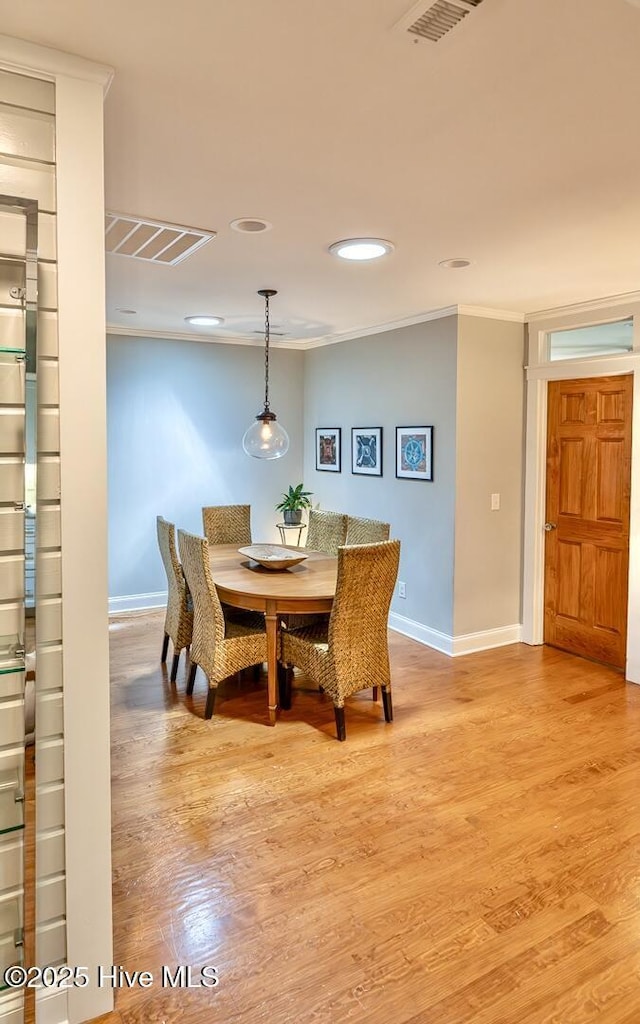 2111 Gibson Ave, Wilmington, NC 28403 - dining space with baseboards, visible vents, and wood finished floors