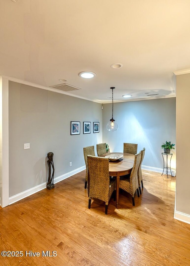 2111 Gibson Ave, Wilmington, NC 28403 - dining space with crown molding, recessed lighting, baseboards, and visible vents