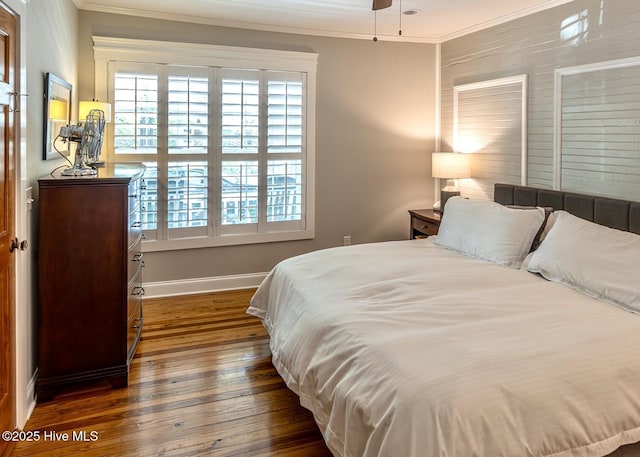 2111 Gibson Ave, Wilmington, NC 28403 - bedroom with crown molding, baseboards, and dark wood-type flooring