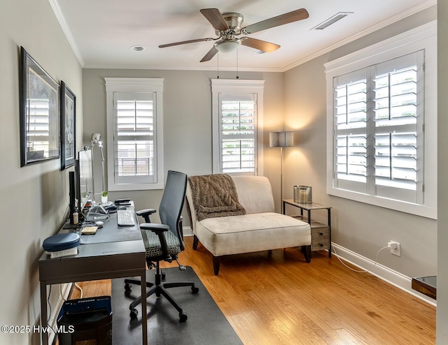2111 Gibson Ave, Wilmington, NC 28403 - home office with ceiling fan, visible vents, crown molding, wood finished floors, and baseboards