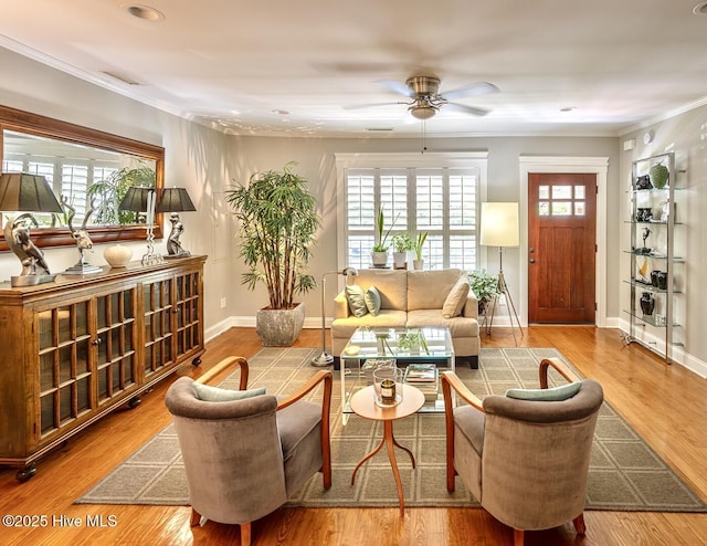2111 Gibson Ave, Wilmington, NC 28403 - living area featuring crown molding, baseboards, ceiling fan, and visible vents