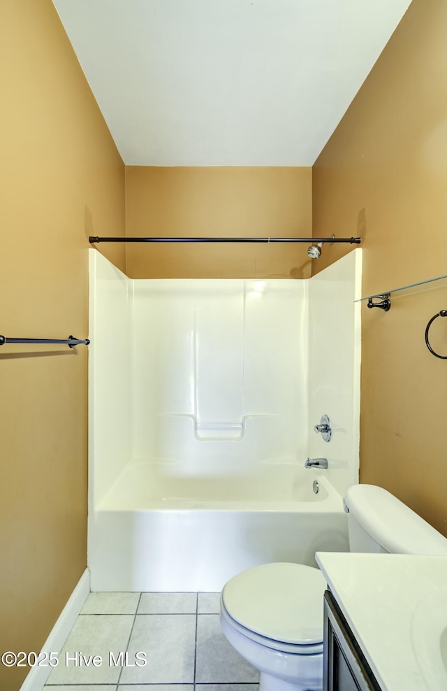 full bathroom with baseboards, toilet, vanity, and tile patterned floors