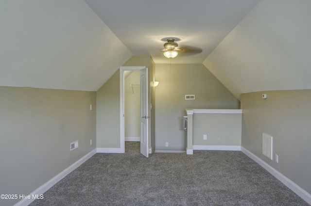 bonus room featuring lofted ceiling, a ceiling fan, visible vents, and carpet
