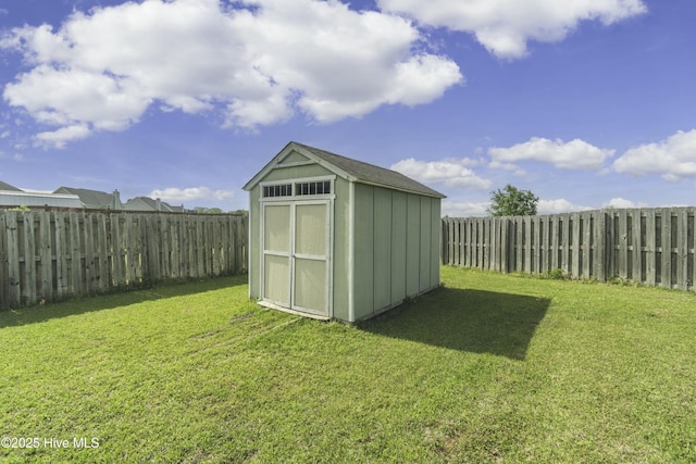 view of shed with a fenced backyard