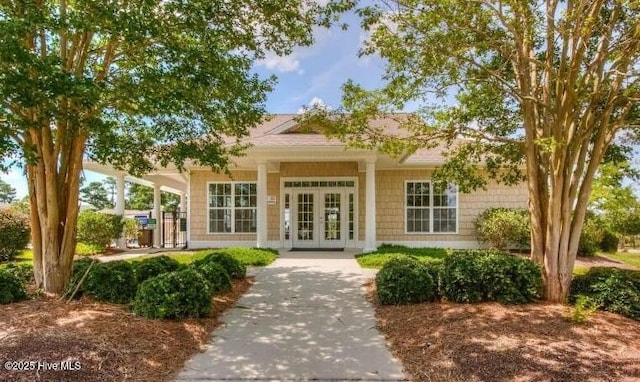 view of exterior entry featuring french doors