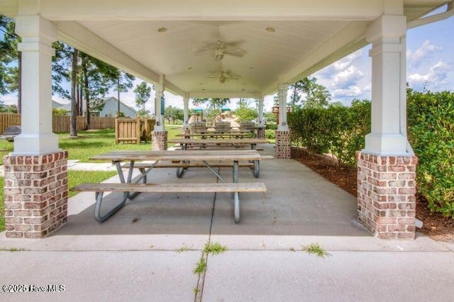 view of patio with fence and ceiling fan