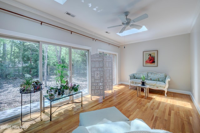 living room featuring visible vents, baseboards, and light wood-style floors