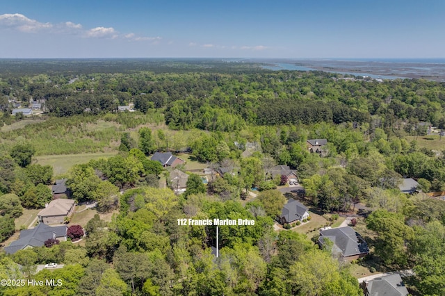 drone / aerial view featuring a forest view
