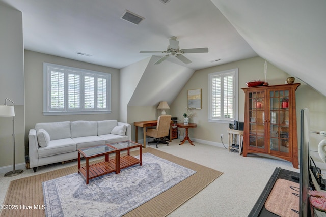 carpeted living room with visible vents, ceiling fan, lofted ceiling, and baseboards