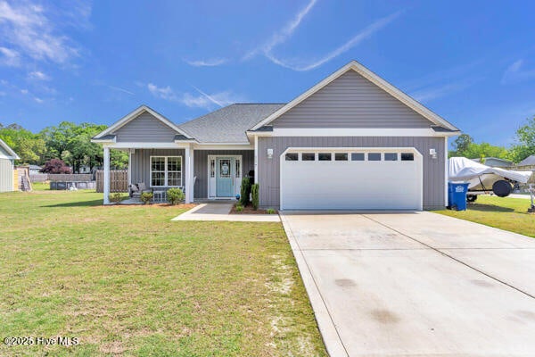 view of front of property featuring driveway, board and batten siding, an attached garage, a porch, and a front lawn