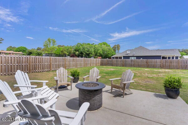 view of patio / terrace with a fire pit and a fenced backyard