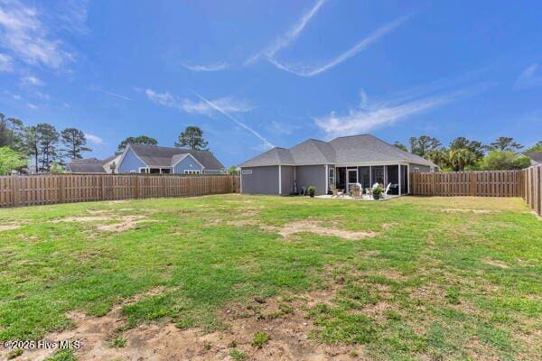 view of yard featuring a fenced backyard