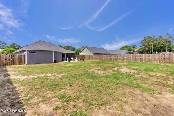 view of yard featuring a fenced backyard