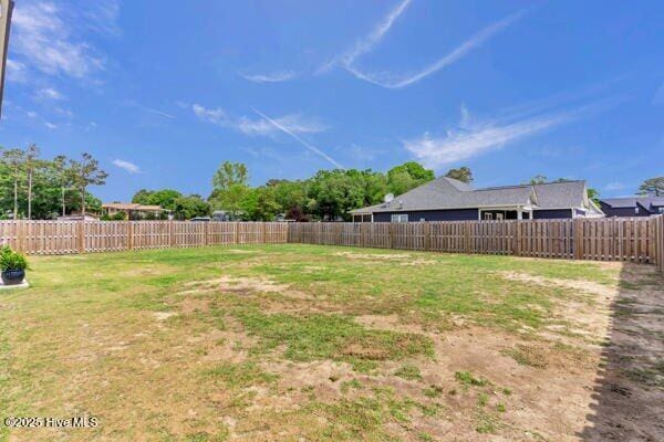 view of yard with a fenced backyard