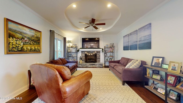 2417 Turtle Bay Dr, New Bern, NC 28562 - living area featuring ceiling fan, a fireplace, dark wood finished floors, baseboards, and a raised ceiling