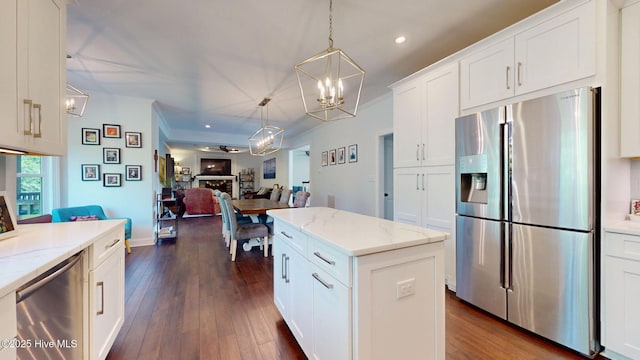 2417 Turtle Bay Dr, New Bern, NC 28562 - kitchen featuring a chandelier, decorative light fixtures, stainless steel fridge with ice dispenser, white cabinets, and open floor plan