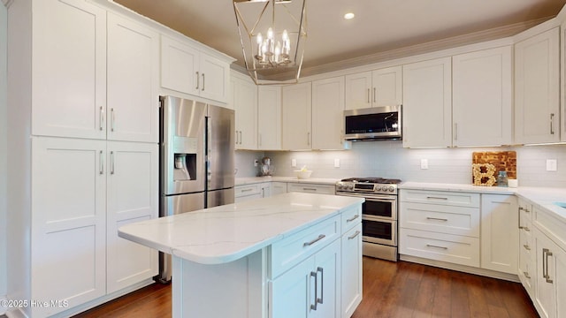 2417 Turtle Bay Dr, New Bern, NC 28562 - kitchen featuring dark wood-type flooring, recessed lighting, a center island, white cabinets, and appliances with stainless steel finishes