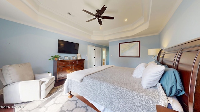 2417 Turtle Bay Dr, New Bern, NC 28562 - bedroom featuring a raised ceiling, recessed lighting, wood finished floors, visible vents, and ornamental molding