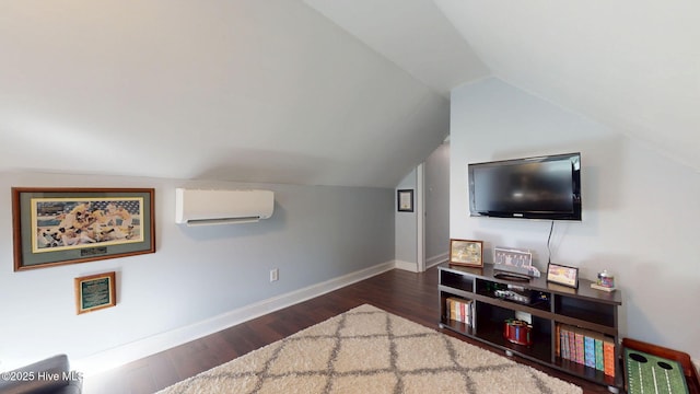 2417 Turtle Bay Dr, New Bern, NC 28562 - interior space with baseboards, a wall mounted AC, vaulted ceiling, and wood finished floors