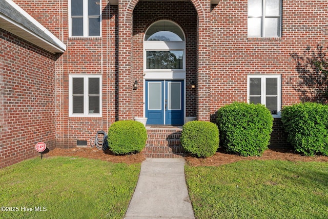 2417 Turtle Bay Dr, New Bern, NC 28562 - property entrance featuring a yard, brick siding, and french doors