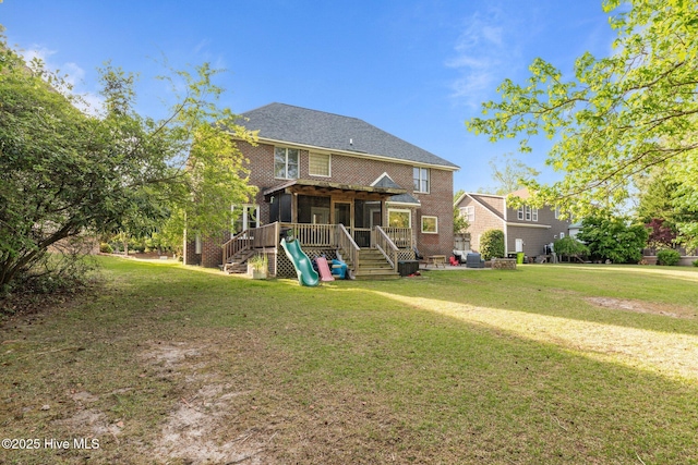 2417 Turtle Bay Dr, New Bern, NC 28562 - back of house with a sunroom, a yard, and stairway