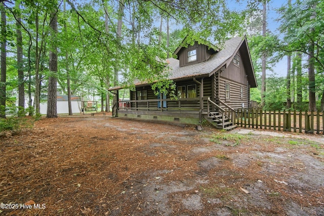 167 Puddin Ridge Rd, Moyock, NC 27958 - view of front of home featuring log exterior, fence, and crawl space