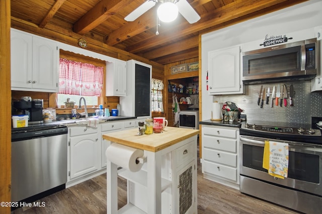 167 Puddin Ridge Rd, Moyock, NC 27958 - kitchen featuring stainless steel appliances, wood counters, wood ceiling, beamed ceiling, and white cabinets