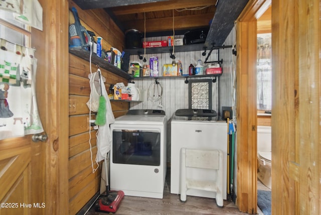 167 Puddin Ridge Rd, Moyock, NC 27958 - laundry room with independent washer and dryer, wood finished floors, and wood walls
