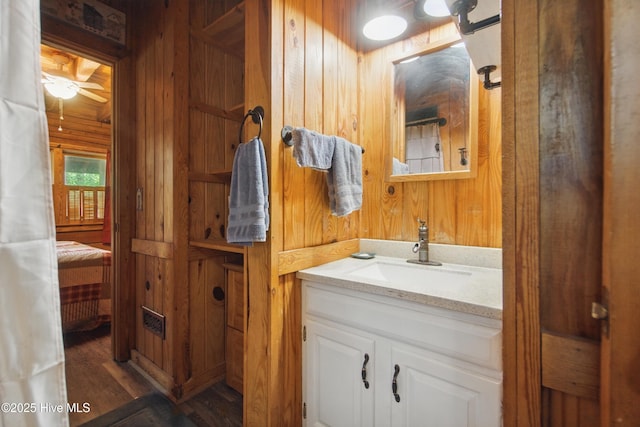 167 Puddin Ridge Rd, Moyock, NC 27958 - bathroom featuring wooden walls, vanity, and wood finished floors