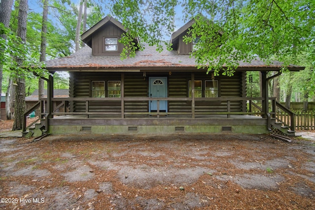 167 Puddin Ridge Rd, Moyock, NC 27958 - log-style house with covered porch, log siding, and crawl space