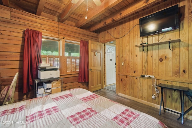 167 Puddin Ridge Rd, Moyock, NC 27958 - bedroom featuring wooden ceiling, wood walls, beamed ceiling, wood finished floors, and baseboards
