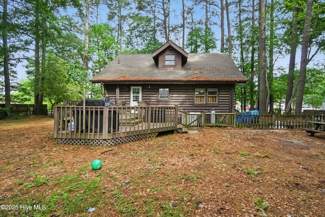 167 Puddin Ridge Rd, Moyock, NC 27958 - rear view of house with log siding, fence, and a wooden deck