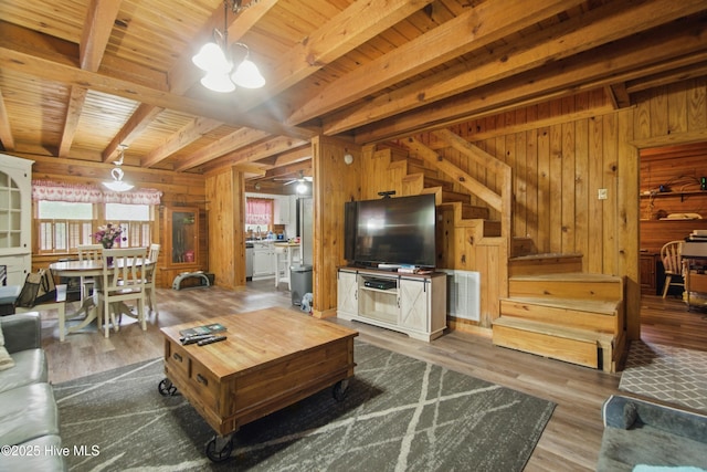 167 Puddin Ridge Rd, Moyock, NC 27958 - living area featuring wooden walls, beamed ceiling, wood ceiling, a chandelier, and wood finished floors