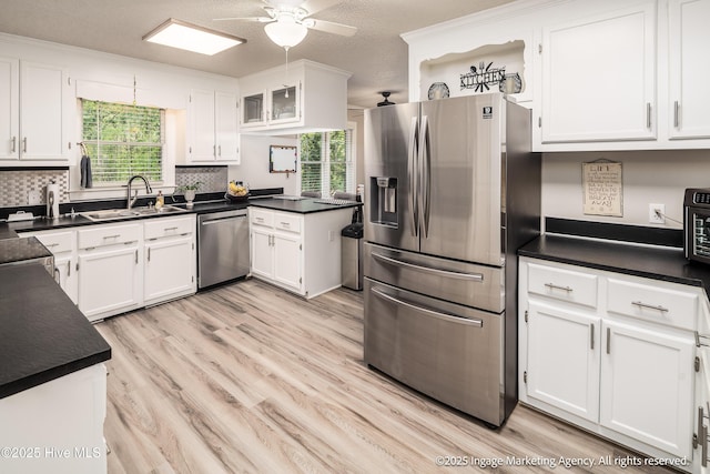869 Driftwood Dr, Greenville, NC 27858 - kitchen featuring stainless steel appliances, a sink, light wood finished floors, and healthy amount of natural light