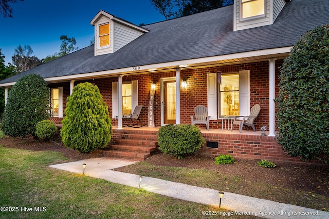 869 Driftwood Dr, Greenville, NC 27858 - new england style home featuring covered porch, brick siding, and roof with shingles