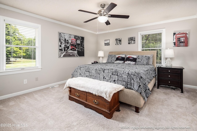 869 Driftwood Dr, Greenville, NC 27858 - carpeted bedroom featuring baseboards, ornamental molding, multiple windows, and ceiling fan
