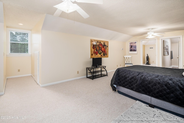 869 Driftwood Dr, Greenville, NC 27858 - bedroom with carpet floors, baseboards, a textured ceiling, vaulted ceiling, and ceiling fan