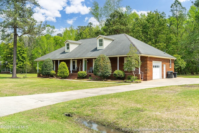 869 Driftwood Dr, Greenville, NC 27858 - new england style home with an attached garage, covered porch, concrete driveway, brick siding, and a front lawn