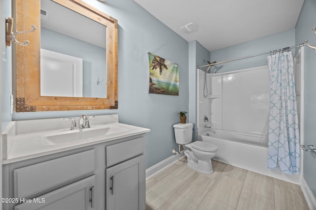 full bathroom featuring toilet, vanity, visible vents, baseboards, and shower / tub combo