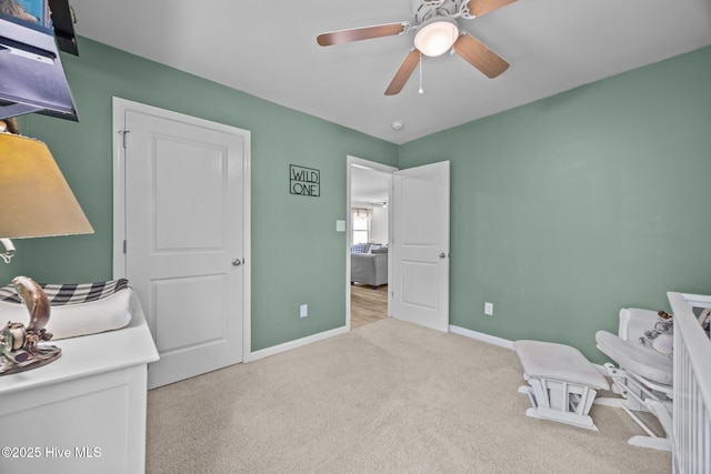 bedroom featuring carpet flooring, baseboards, and a ceiling fan